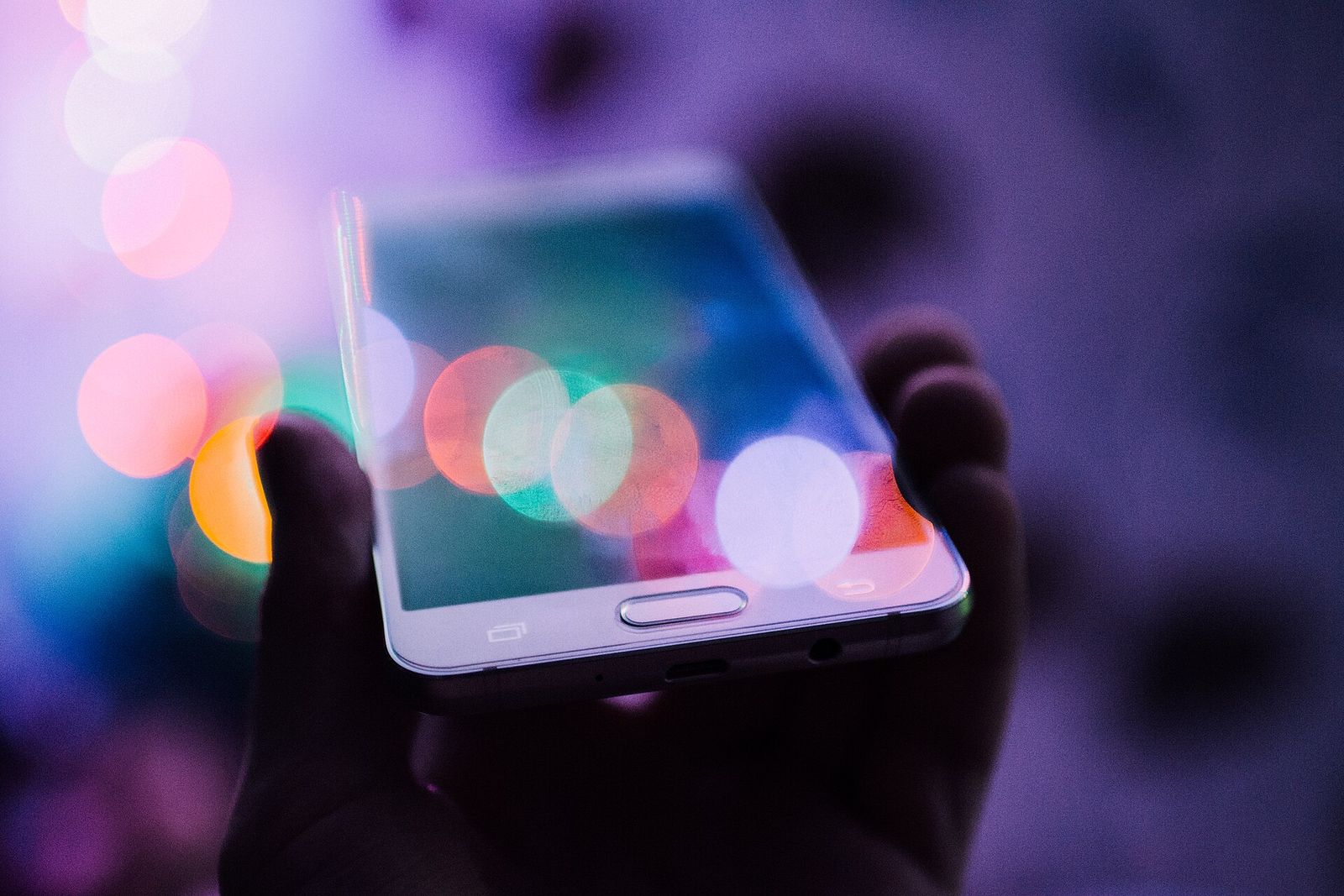 A smartphone held in one hand showing its screen.