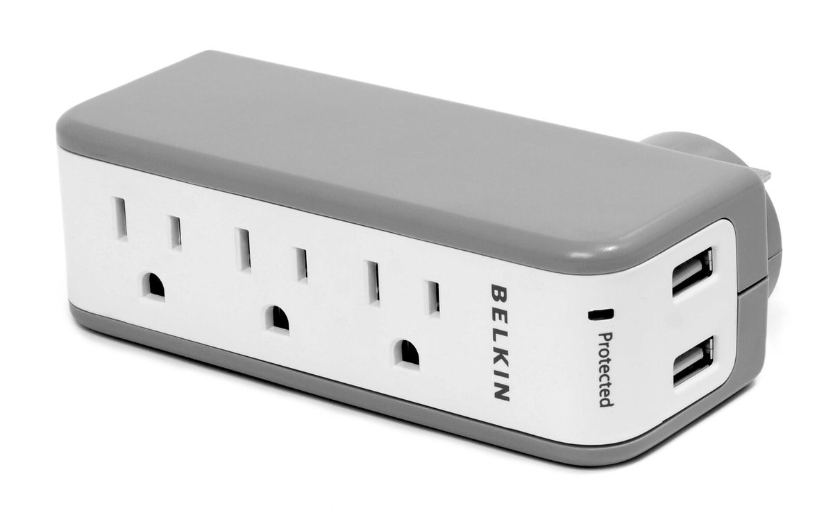A surge protector power strip with multiple outlets.